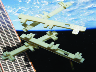 White plastic structures floating in space against the Earth