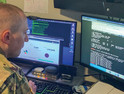 Army Maj. Jared Hrabak, a cyber officer with the Army Reserve’s Cyber Protection Team 185, uses a common network scanning tool called “masscan” to enumerate a network during his unit’s virtual battle assembly at Joint Base Langley-Eustis, Va., Aug. 9, 2020.