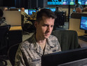 Tech. Sgt. Kyle Hanslovan, a cyber-warfare specialist serving with the 175th Cyberspace Operations Group of the Maryland Air National Guard, works in the Hunter's Den at Warfield Air National Guard Base, Middle River, Md., Dec. 2, 2017. 