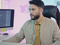 Person coding at computer