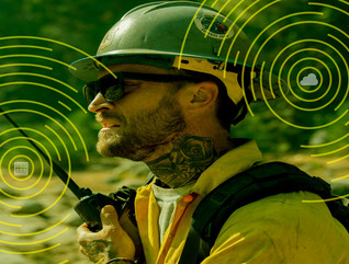 Person working outside using mobile equipment