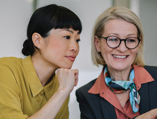 Two coworkers collaborating in the office