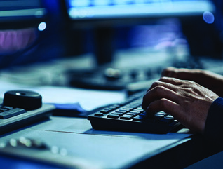 An analyst at a keyboard