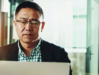 Man submitting information on a laptop
