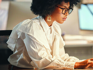 Person using laptop at the office