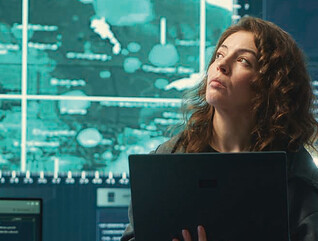Person observing screens in SCIF