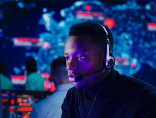 Person using headset at computer