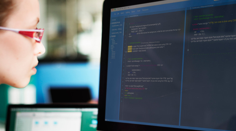 A woman programmer working on a cloud environment 
