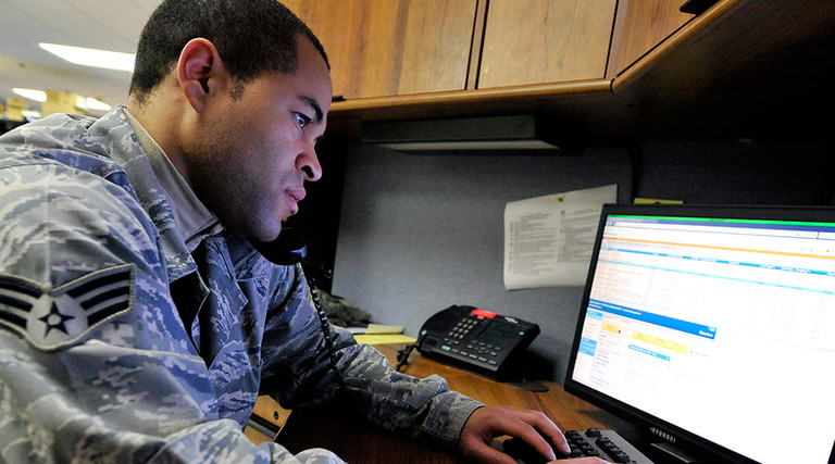 Senior Airman Jason McKenzie, client systems technician from the 436th Communications Squadron, troubleshoots a computer issue by remotely logging into a customer's computer Jan. 19, 2012, at Dover Air Force Base, Del. 
