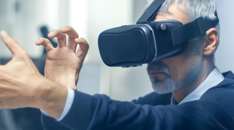 Federal worker manipulating a virtual object while wearing a VR headset 