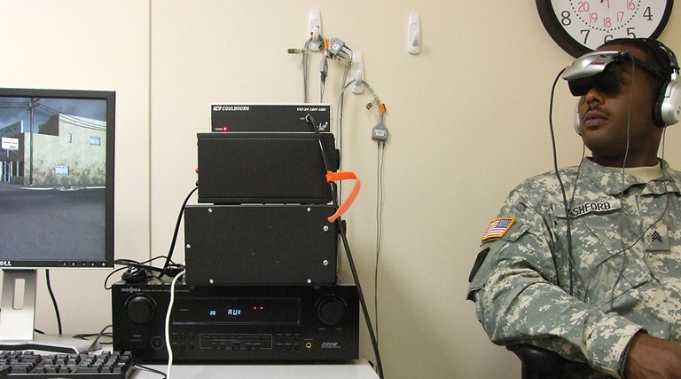 Army Sgt. Lenearo Ashford, Technical Services Branch, Uniformed Services University, undergoes a demonstration of "Virtual Iraq," a life-like simulator that represents a new form of PTSD exposure therapy at Walter Reed Army Medical Center in Washington, D.C., on Sept. 16, 2008.