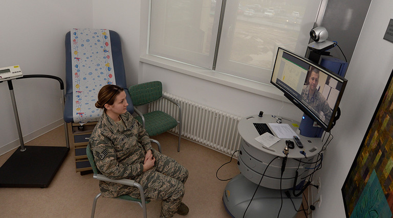 Senior Airman Kimberly Deveau sits in a private room at Spangdahlem Air Base, Germany as she receives specialty genetic counseling via a video teleconference from Capt. (Dr.) Mauricio De Castro, staff medical geneticist at Keesler Air Force Base, Miss., Feb. 1, 2018