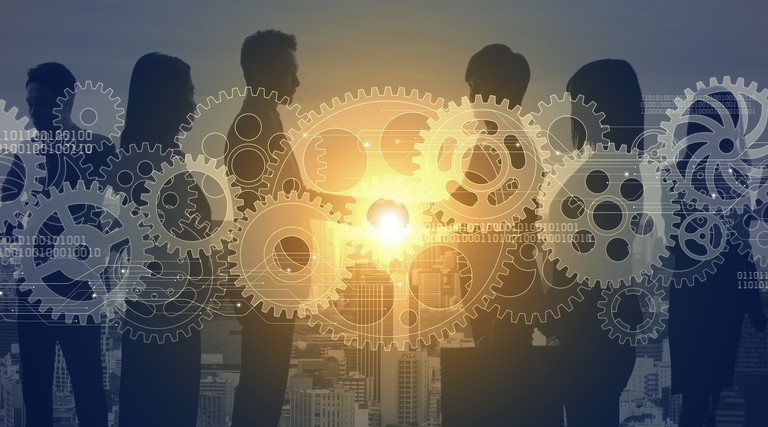 People surrounded by gears