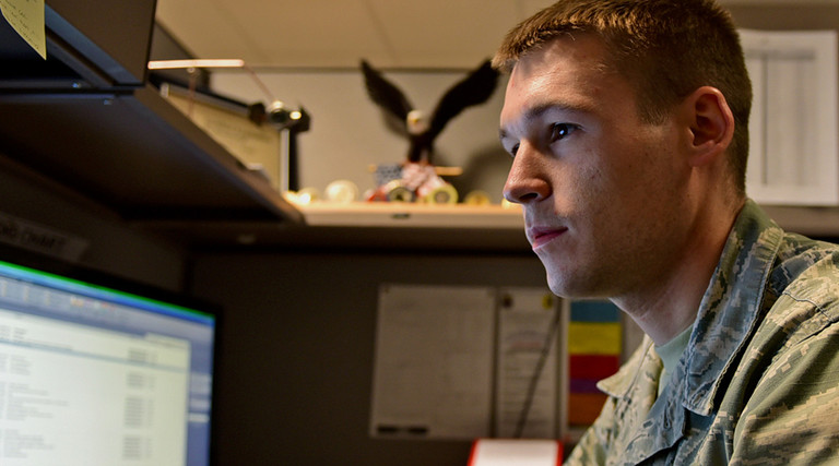 Staff Sgt. Chris Meyer, a 28th Contracting Squadron contract administrator, reviews paperwork at Ellsworth Air Force Base, S.D., Nov. 4, 2015.