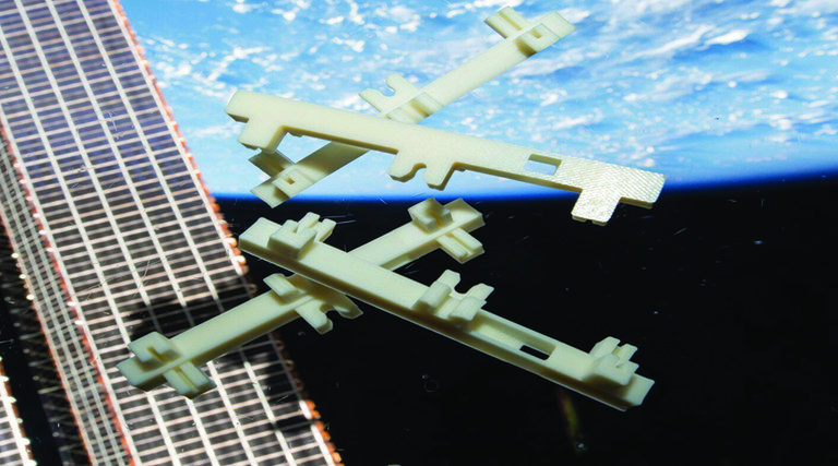 White plastic structures floating in space against the Earth