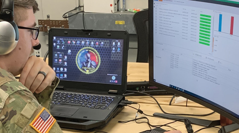 Spc. James Hyman, 915th CWB, completes an event-driven cyberspace incident scenario from the perspective of an intelligence analyst using the Cyber SU software application. 