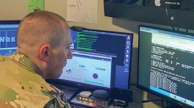 U.S. Army Reserve Maj. Jared Hrabak, a cyber officer with Cyber Protection Team 185 uses a common network scanning tool “masscan” to enumerate a network. during his unit’s Virtual Battle Assembly Aug. 9, 2020. 