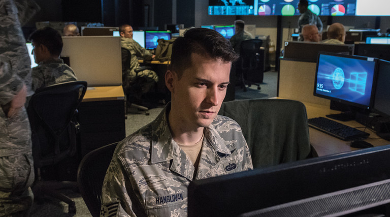 Tech. Sgt. Kyle Hanslovan, a cyber-warfare specialist serving with the 175th Cyberspace Operations Group of the Maryland Air National Guard, works in the Hunter's Den at Warfield Air National Guard Base, Middle River, Md., Dec. 2, 2017. 