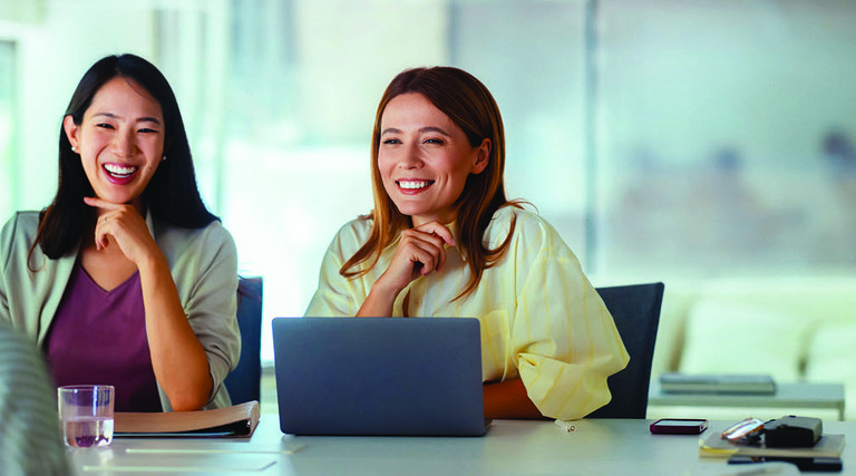 Three people in a business meeting