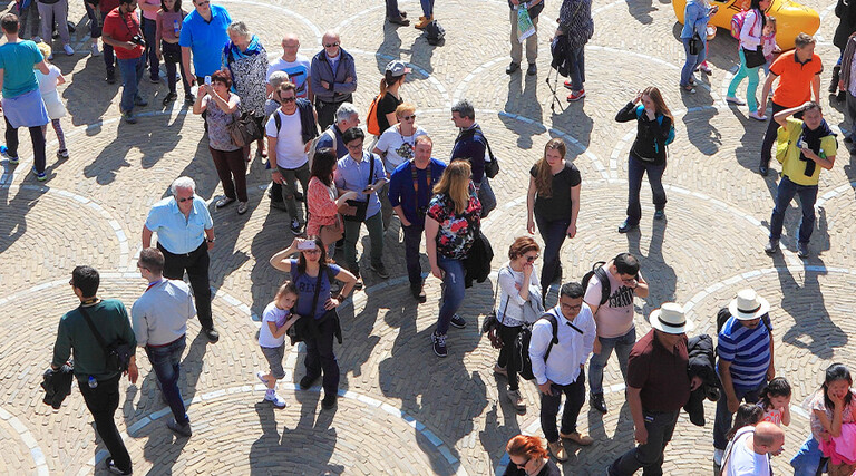 People walking through city