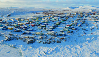 Aerial view of tiny Alaska village in the snow