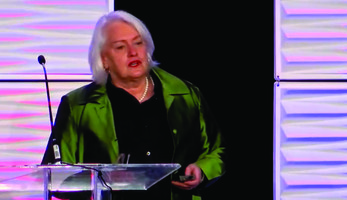 woman in shiny green jacket