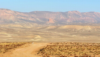 Desert road with mountains