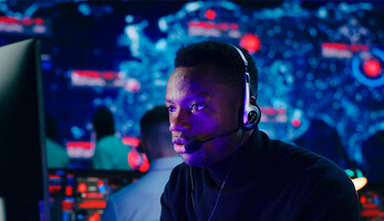 Person using headset at computer