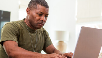 Person using computer at home