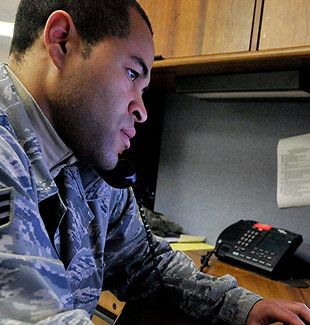 Senior Airman Jason McKenzie, client systems technician from the 436th Communications Squadron, troubleshoots a computer issue by remotely logging into a customer's computer Jan. 19, 2012, at Dover Air Force Base, Del. 