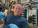 International Space Station Expedition 42 Commander Barry "Butch" Wilmore shows off a ratchet wrench made with a 3D printer on the station.