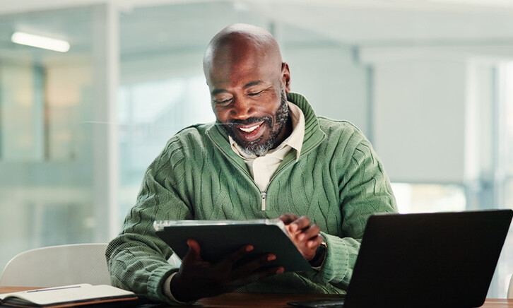 Person using tablet in the office