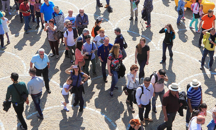 People walking through city
