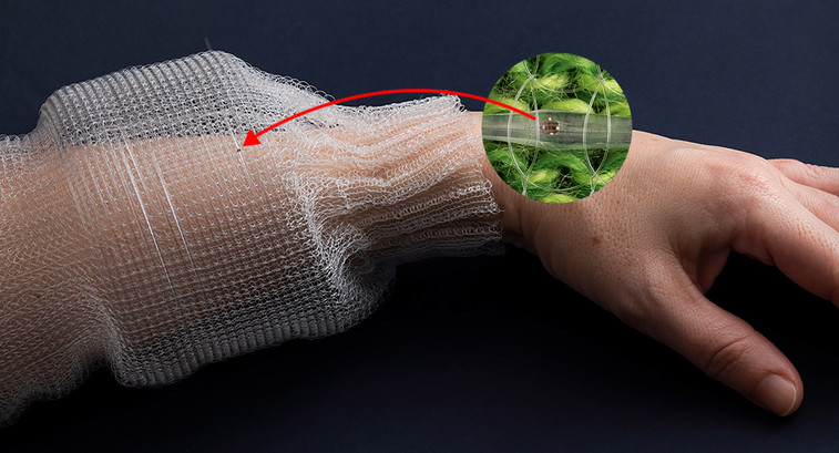 Chips inside a thin fiber can monitor vital signs when the fiber is sewn into cloth.