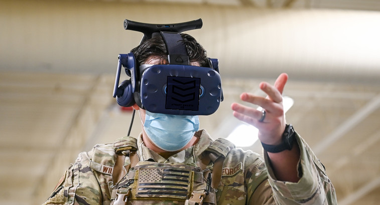An Air Force serviceman uses an AR/VR headset