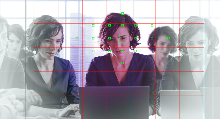 Reflected image of person using computer