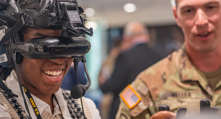 Army intern tries on a virtual reality headset