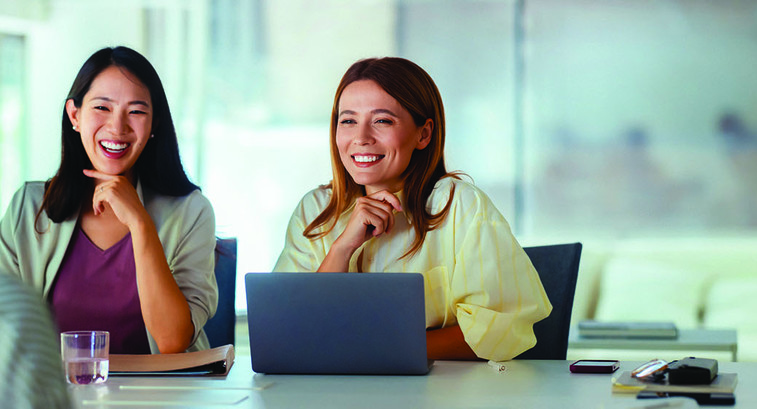 Three people in a business meeting