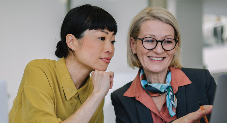 Two coworkers collaborating in the office