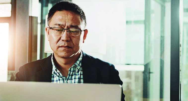 Man submitting information on a laptop