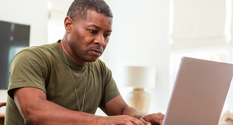 Person using computer at home