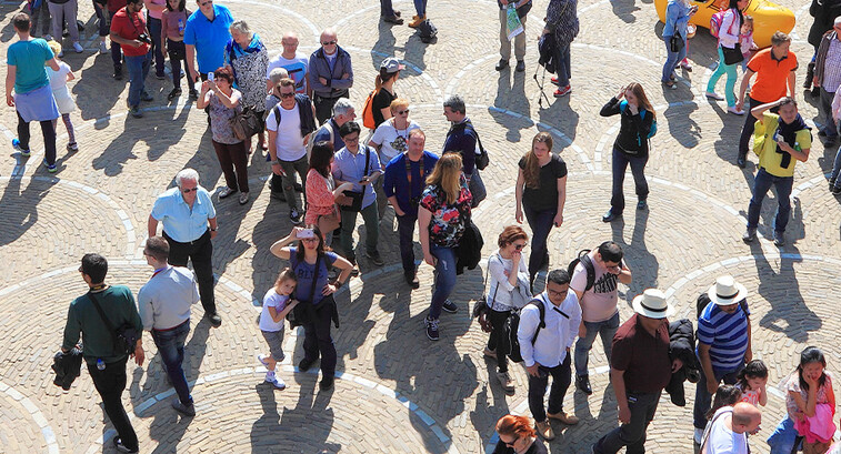 People walking through city