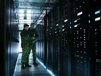 Army officers working in a data center 