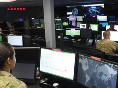 Sgt. Marisa Tortolano, a cyber operations specialist assigned to the 780th Military Intelligence Brigade, stands in the watch officer position of the Joint Mission Operations Center.
