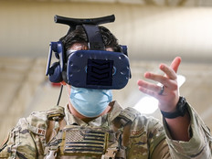 An Air Force serviceman uses an AR/VR headset