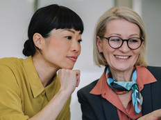 Two coworkers collaborating in the office