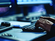 An analyst at a keyboard
