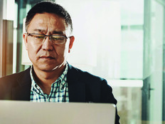 Man submitting information on a laptop