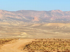 Desert road with mountains