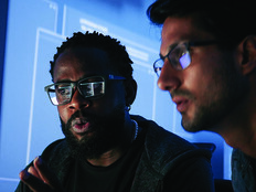 Colleagues reviewing information on computer